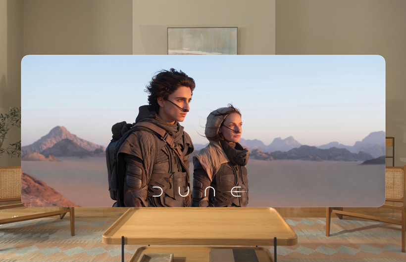 Two main characters from the film Wicked in the Apple TV app on Apple Vision Pro.