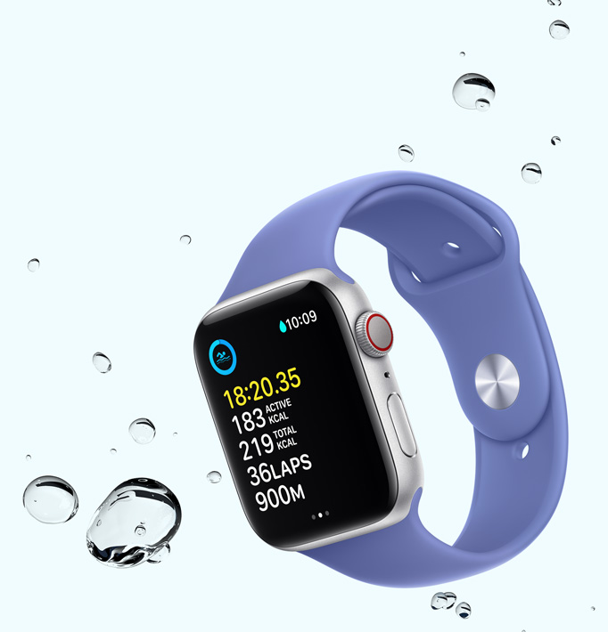 Apple Watch SE displaying a swim workout screen with water droplets near the device