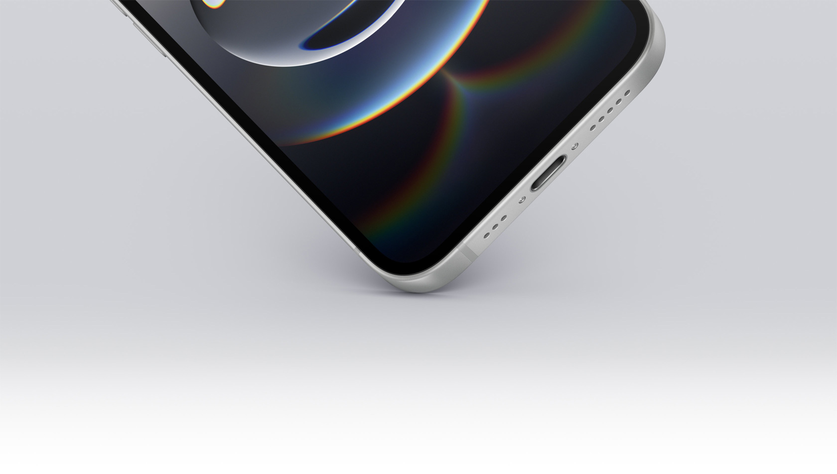 الزاوية السفلية لجهاز iPhone 16e تلمس الأرض وتعرض منفذ USB-C‏.